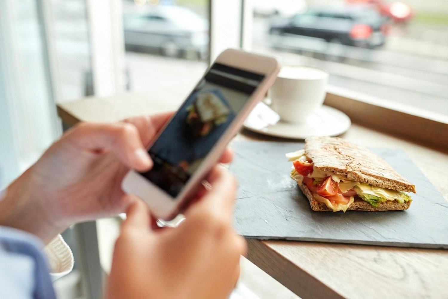 Guest using a smartphone to make a hotel restaurant reservation online